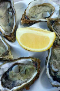 Authentic bordelaise oysters on a plate with lemon