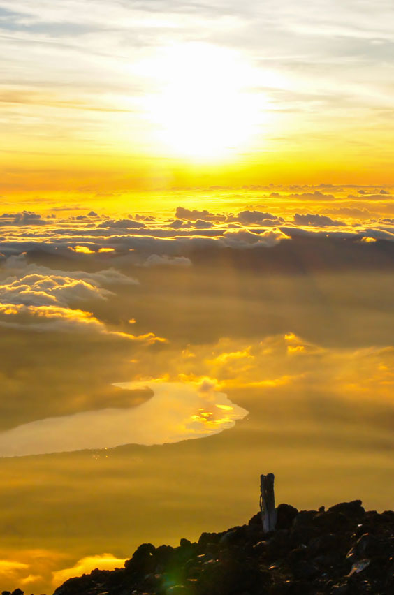 14. Watch the sunrise from Mount Fuji in Japan. Test your hiking abilities on this holy mountain, a sacred site for the Shinto, and active volcano. These photos are what you'll show your children some day. See this opportunity and others on our blog.