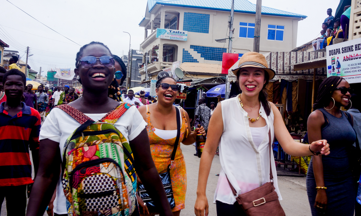 students walking down the streets of a market