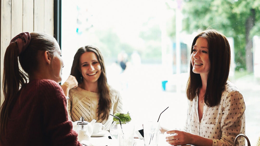 Young women interview in a cafe