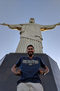 Ricardo Martinez in front of the Christ the Redeemer statue