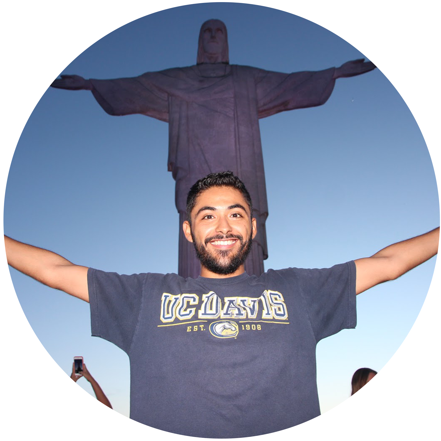 Ricardo Martinez poses in front of the Christ the Redeemer statue