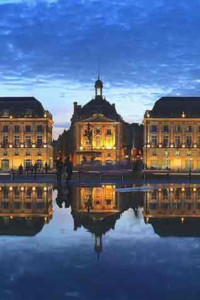 Plaza with mirror pool in Bordeaux at night 