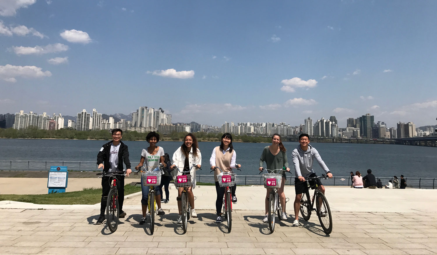 Students riding bikes at Hangang River in South Korea