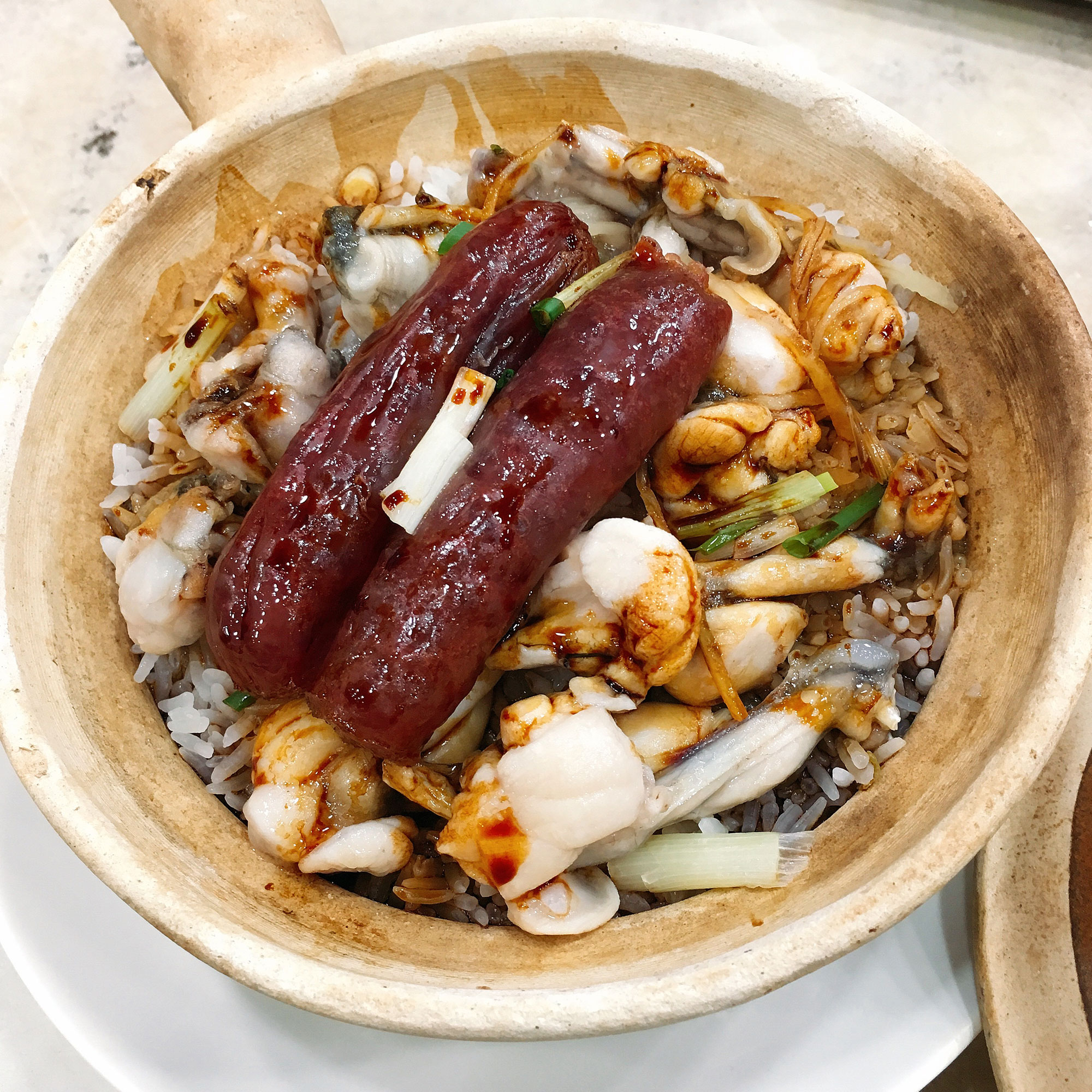 Claypot rice with rice veggies and meat in Hong Kong.