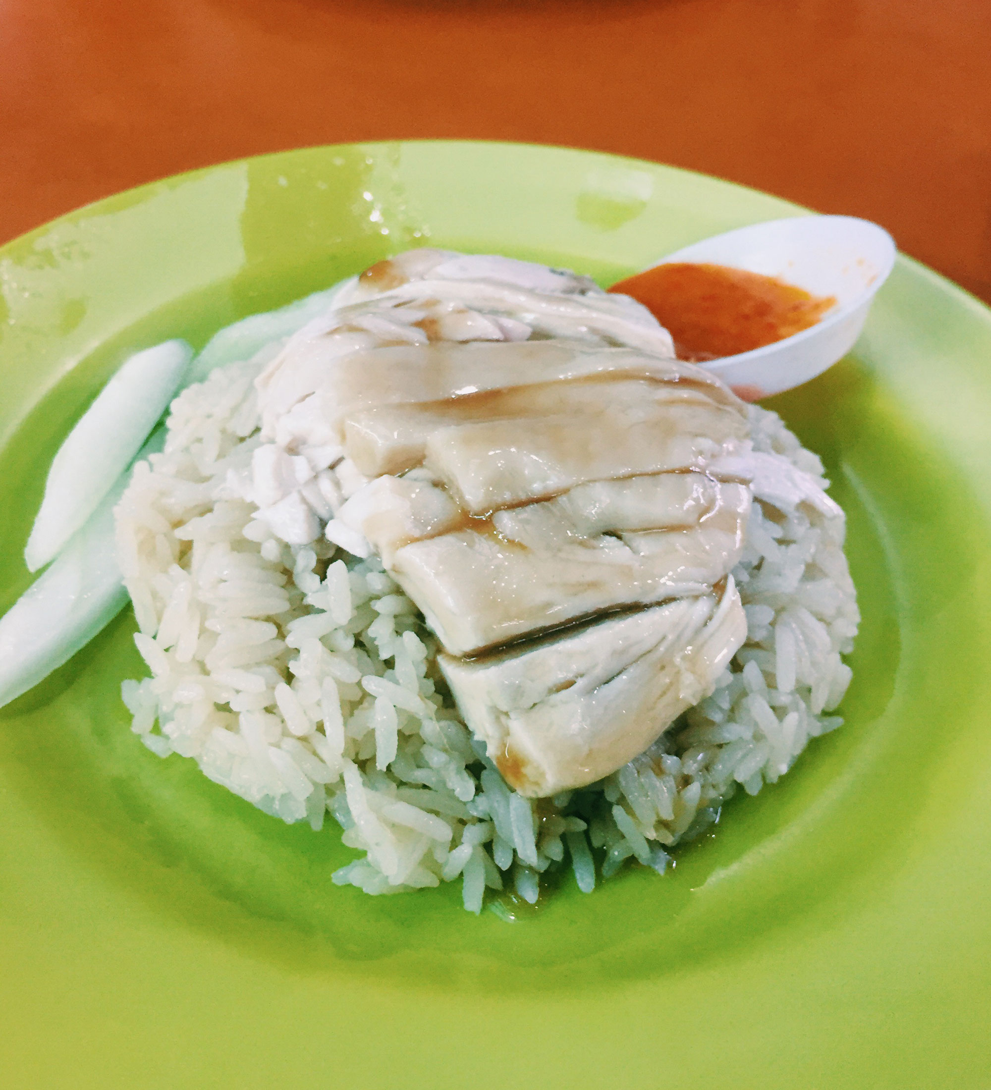 Chicken and rice on a green plate