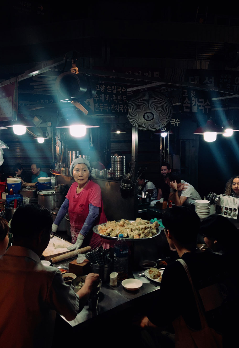 Woman serving food at Gwanjang Market