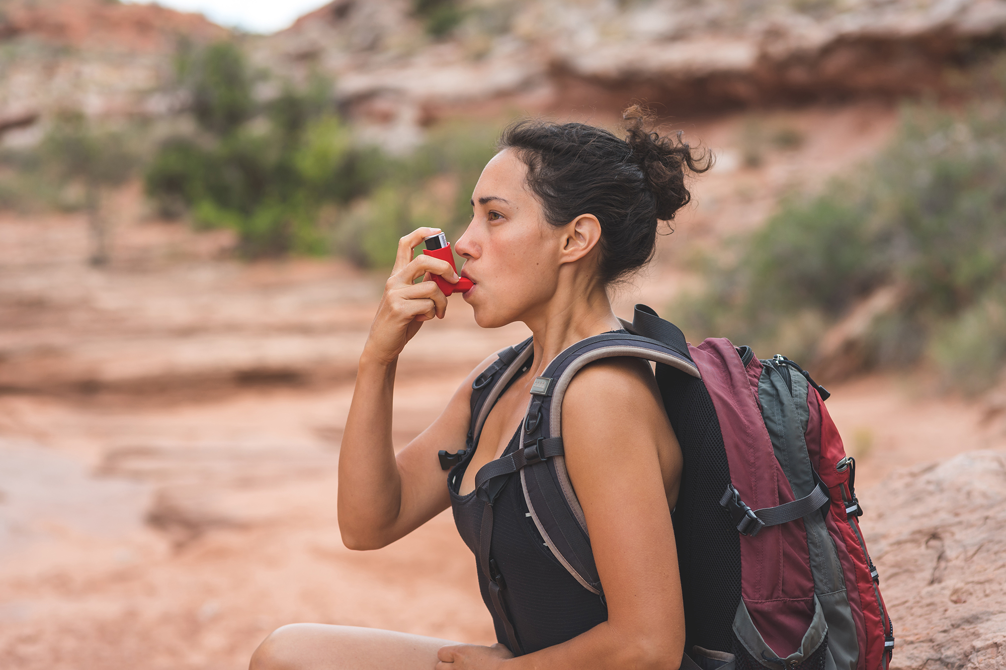 Woman With Chronic Asthma Hiking in Desert