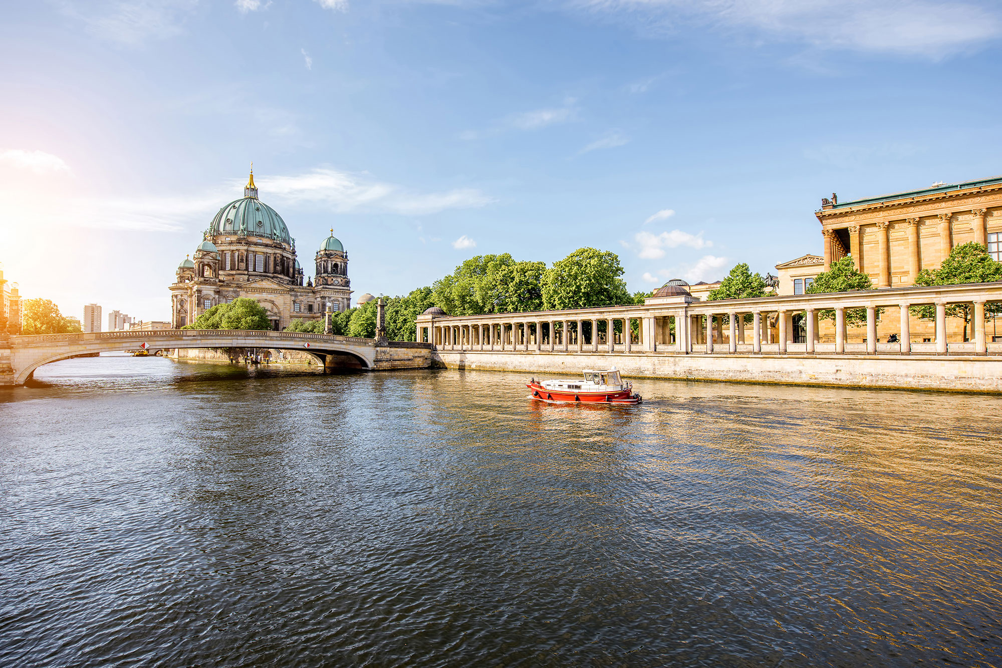 Sunrise view on the riverside with a National gallery building and cathedral in the old town of Berlin city.