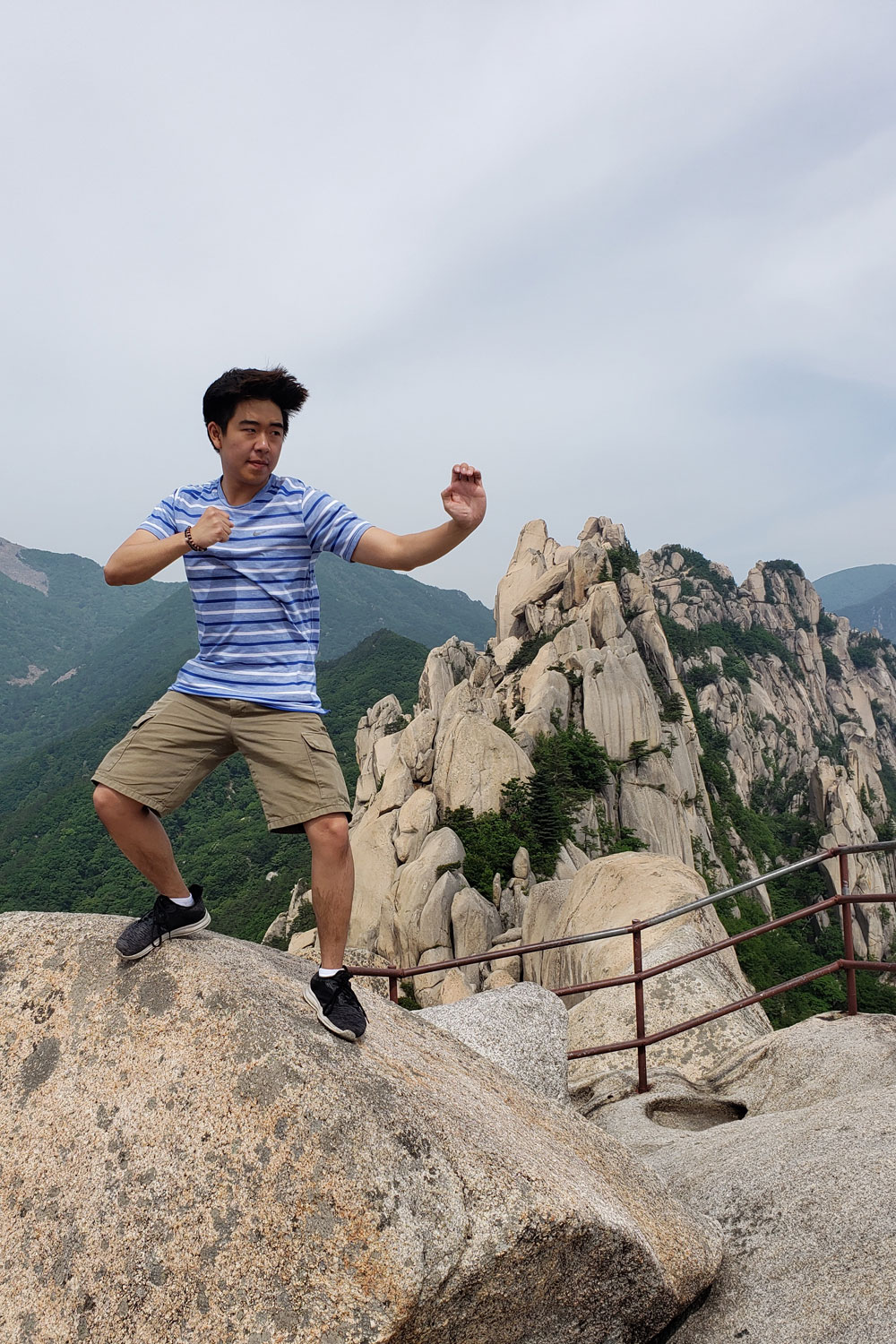 Brandon Yoon poses atop a rock on Seorak Mountain.
