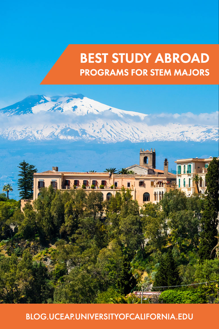 View overlooking terracotta hillside houses with snow-covered Mount Etna in the distance.