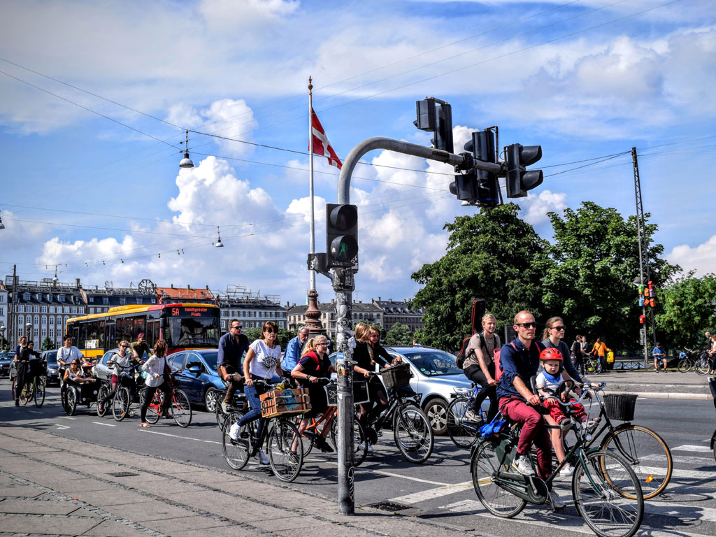 Public transportation at a busy intersection in Copenhagen, Denmark.