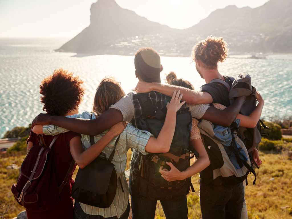 Five friends linking arms and enjoying the view in Cape Town South Africa