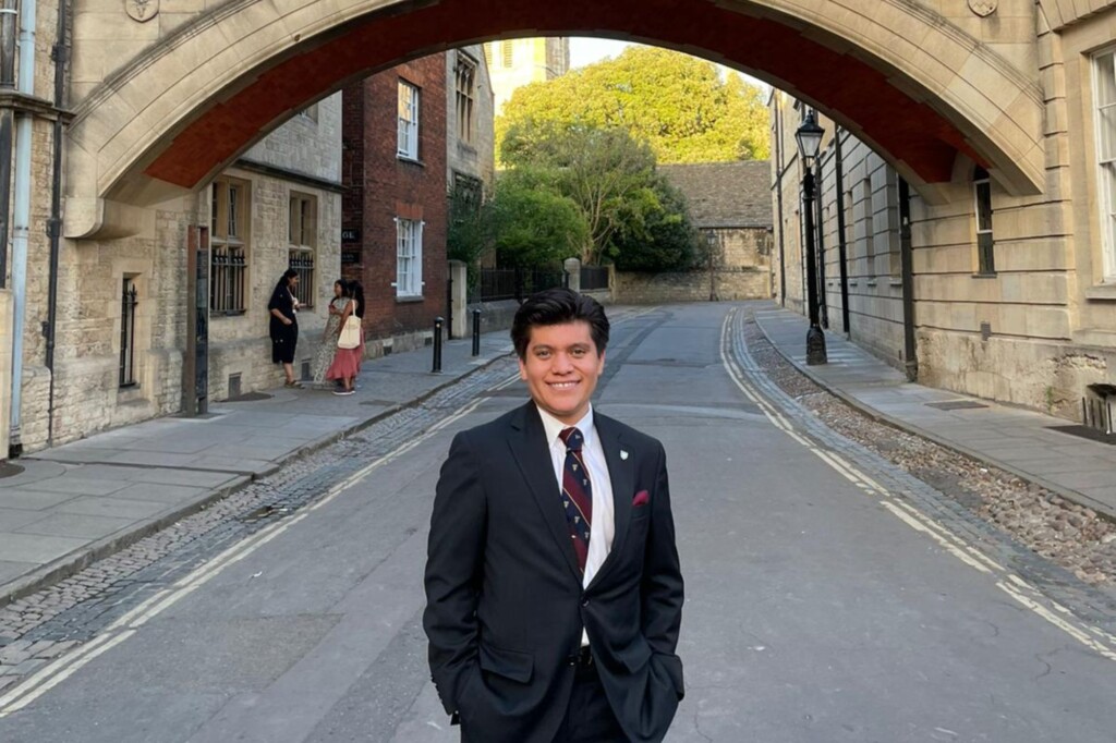 Joshua Swank smiles and poses for a picture at Herford Bridge (the Bridge of Sighs) in Oxford.