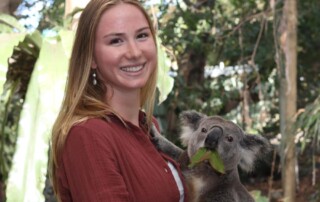 Dorienne Larbig poses with a koala in Australia.