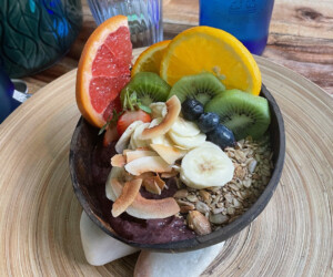 Smoothie bowl with granola and fresh colorful fruits