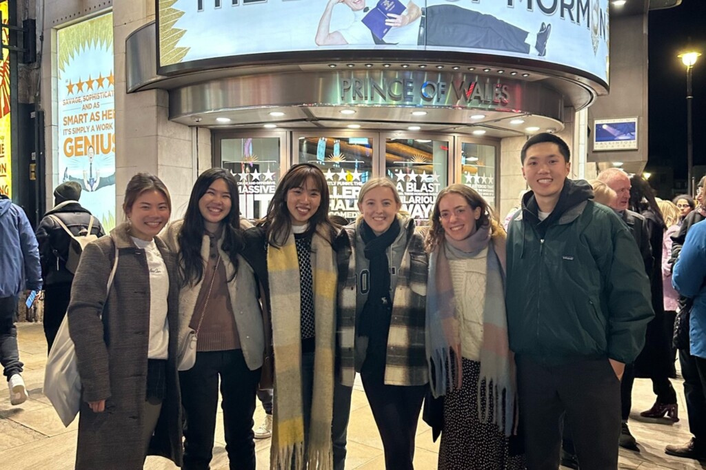 Students in front of a theater