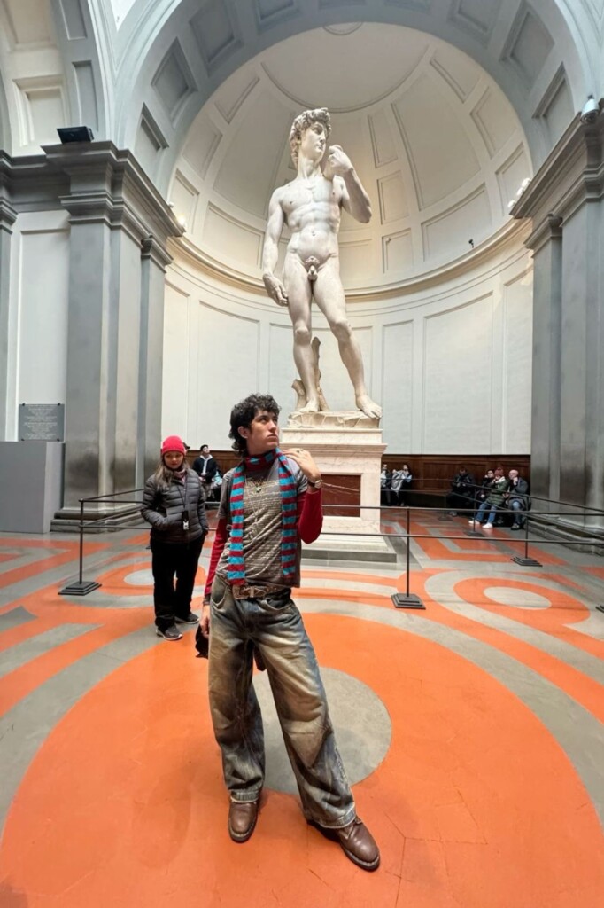 Trey Timberlake posing with the statue of David