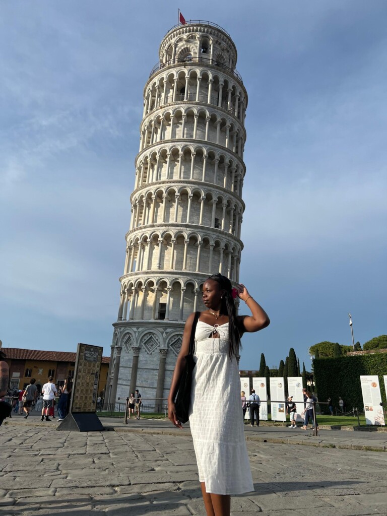 Photo of student in front of Tower of Pisa