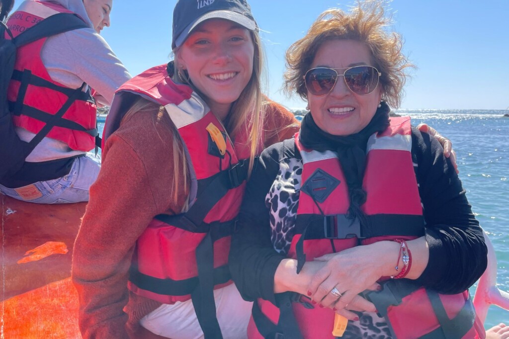 Jamie Stickelmaier and host mom on boat with life jackets