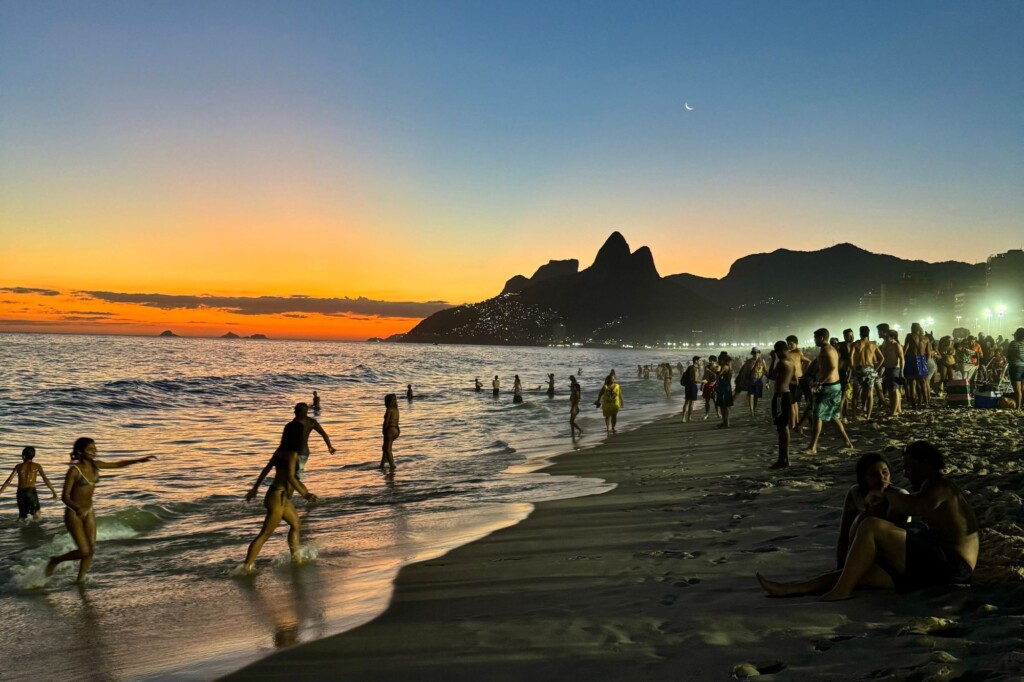 Brazilian beach at sunset with people