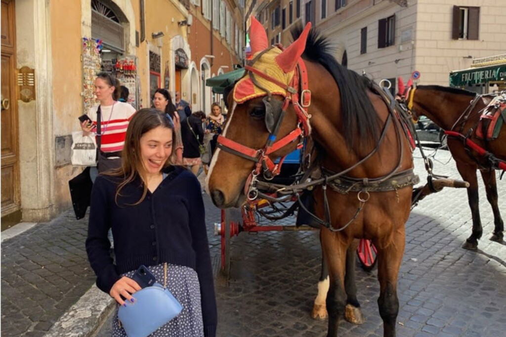 Keren Dror (UC Los Angeles) student in Paris with a horse drawing a carriage