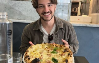 Jacob Dicker (UCSB) with a pizza on study abroad