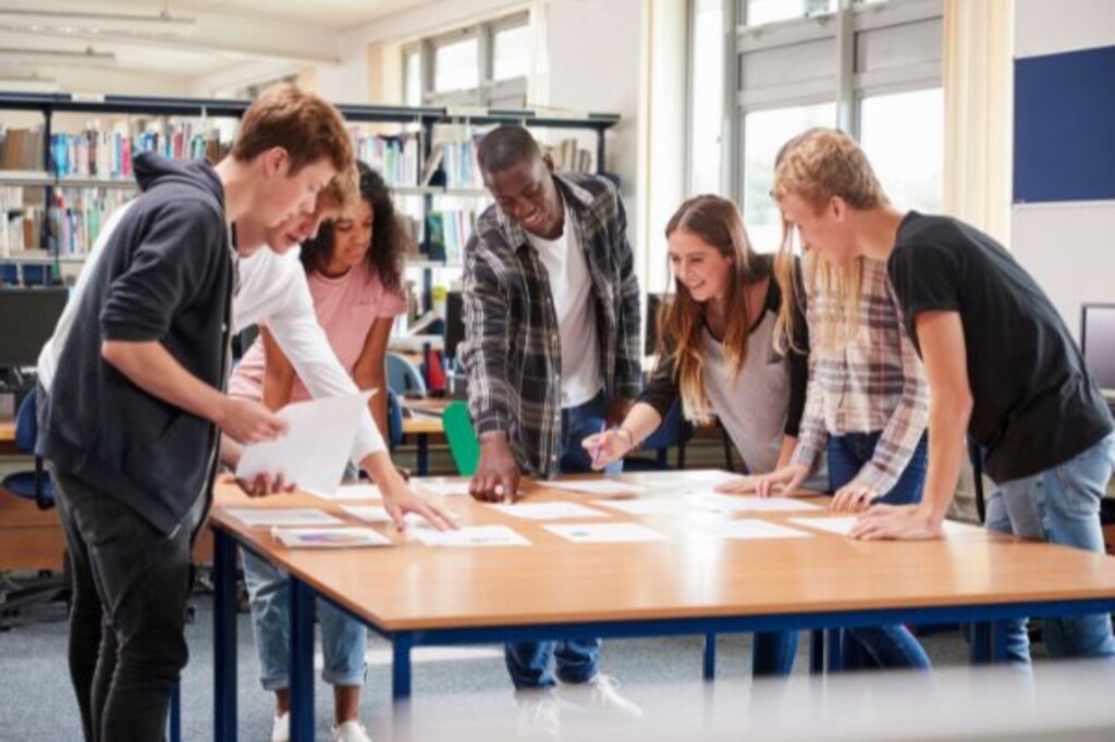 Students around a table working together