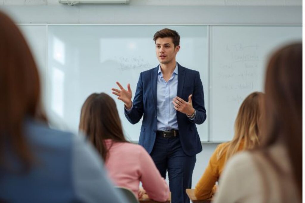 teacher abroad in front of whiteboard talking to class