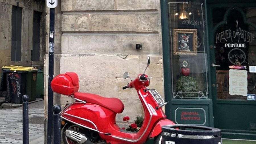 Small red motorcycle on French street