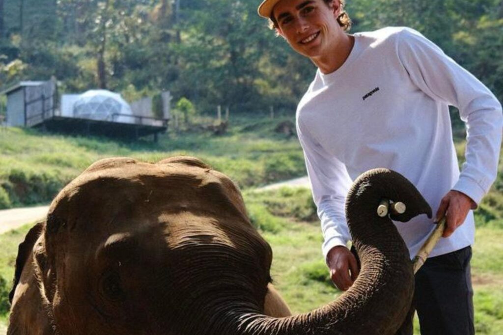Clark Boyce (UCB) with small elephant