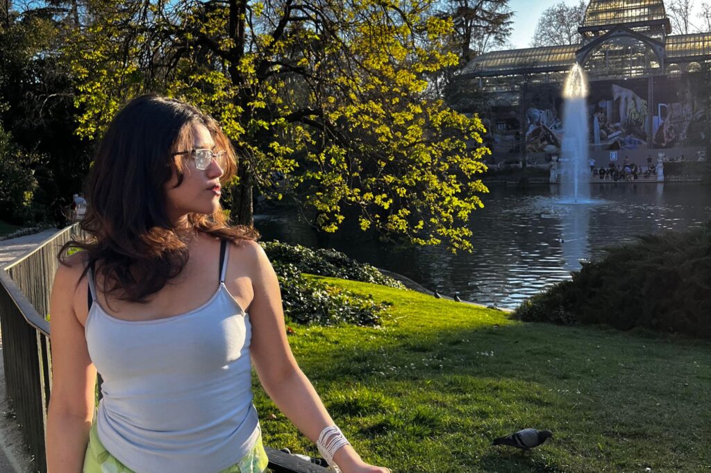 Terra looking over a fountain in Spain