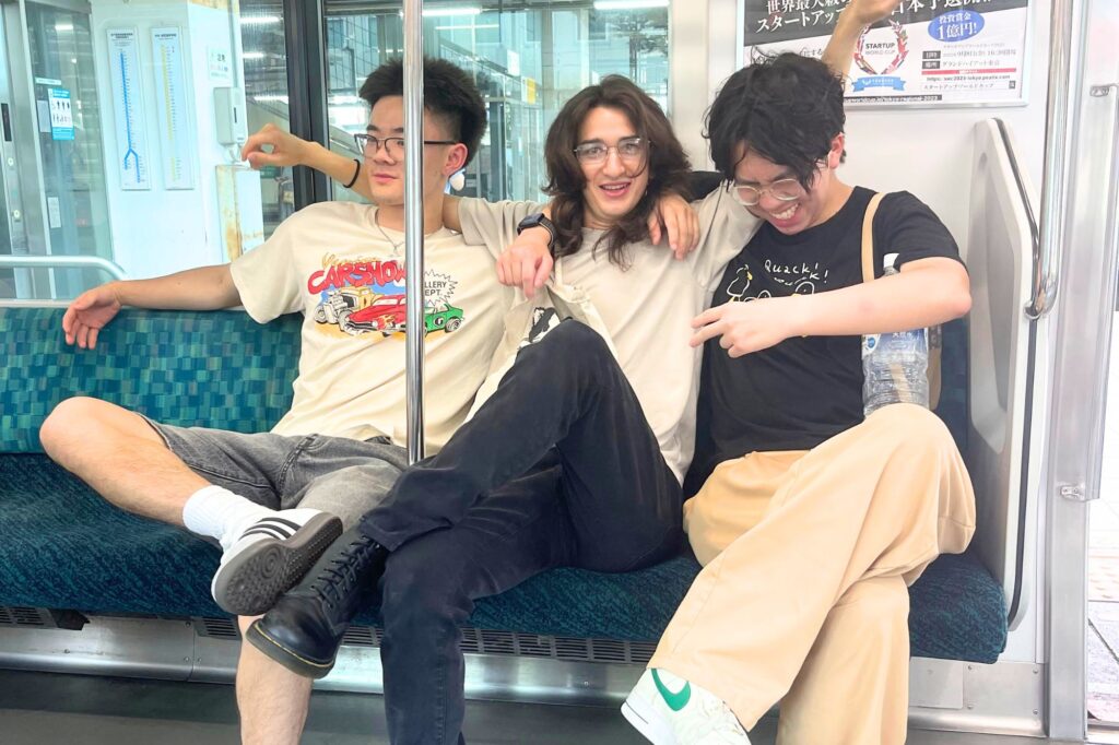Harry Shih (UCSD) with friends on a train in Japan